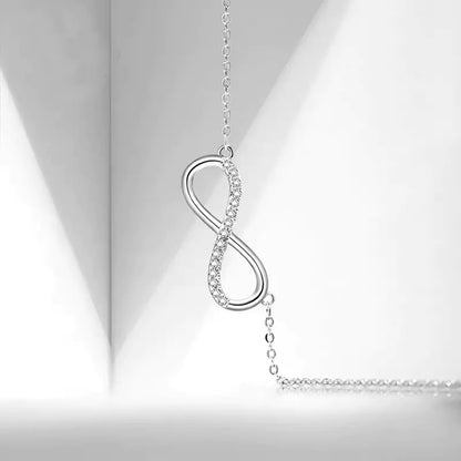 Infinity Bond Necklace on a light gray background
