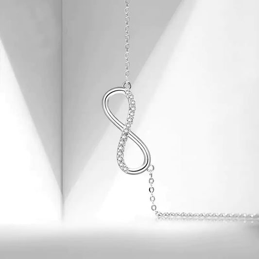 Infinity Bond Necklace on a light gray background